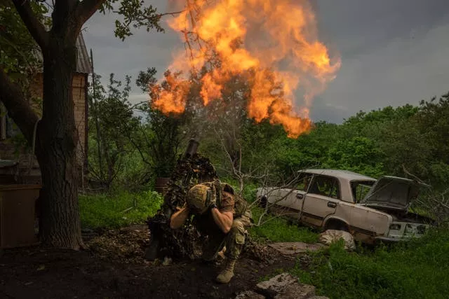 A Ukrainian soldier fires a mortar at Russian positions on the front line near Bakhmut, Donetsk region, Ukraine, last Sunday