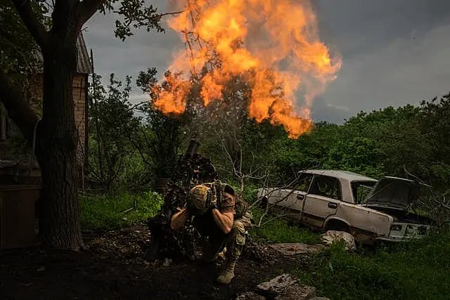 A Ukrainian soldier fires a mortar at Russian positions on the front line near Bakhmut, Donetsk region, Ukraine, last Sunday