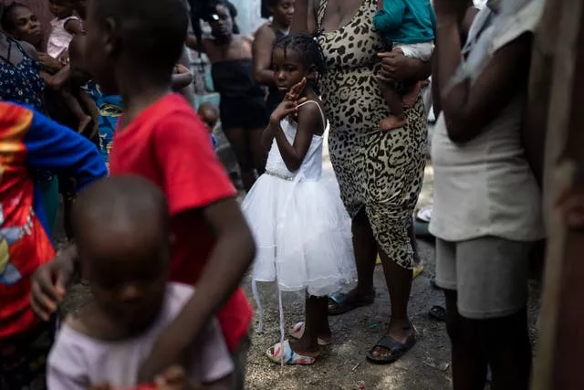 People displaced by gang violence take shelter in Jean-Kere Almicar’s front yard