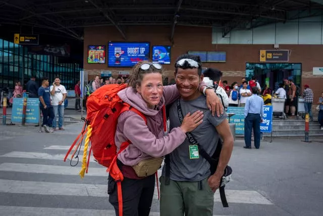 Norwegian climber Kristin Harila, 37, left, and her guide Tenjen Sherpa pose for a photograph in Kathmandu, Nepal