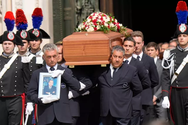 The coffin of media mogul and former Italian premier Silvio Berlusconi leaves the Milan’s Gothic Cathedral at the end his state funeral