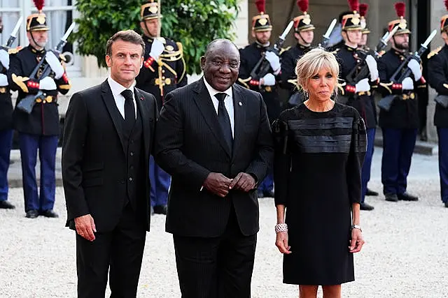 French President Emmanuel Macron and his wife Brigitte welcome Cyril Ramaphosa, centre, before dinner at the Elysee Palace in Paris earlier this month