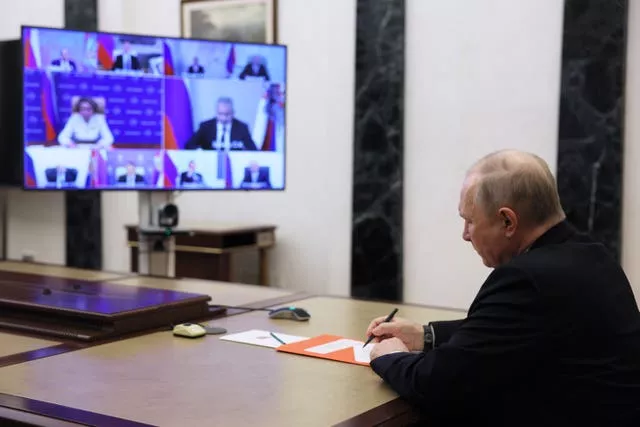 Russian President Vladimir Putin chairs a Security Council meeting via video conference in Moscow, Russia