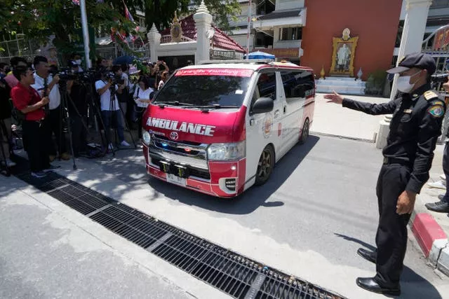 An ambulance carrying an injured student leaves the school in Bangkok 