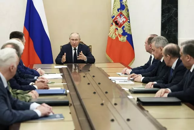 Russian President Vladimir Putin chairs a meeting with the heads of Russian law enforcement agencies (Valery Sarifulin/AP)