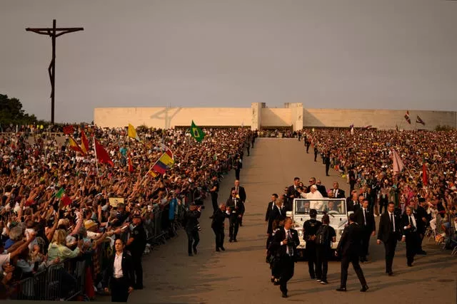 Pope Francis arrives surrounded by bodyguards at Our Lady of Fatima shrine in Fatima, central Portugal 