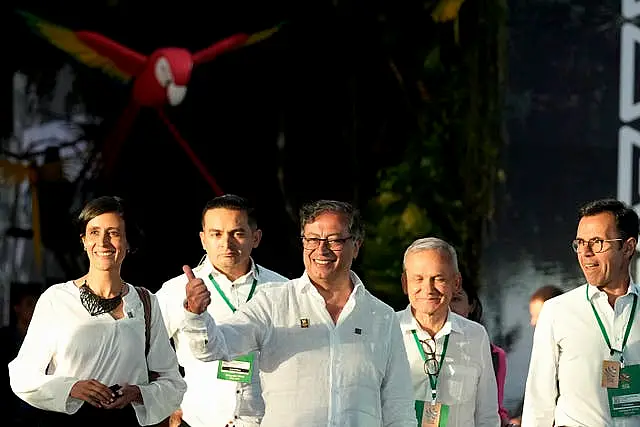 Colombia’s President Gustavo Petro gives a thumbs up as he departs the summit in Belem, Brazil