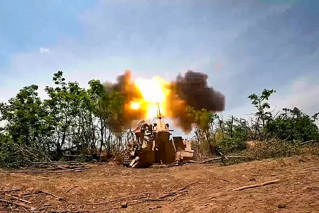 A Russian howitzer fires towards Ukrainian positions at an undisclosed location