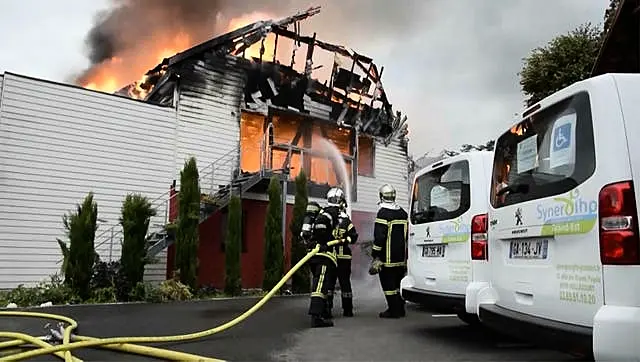 Firefighters tackling the blaze at a vacation home in the town of Wintzenheim