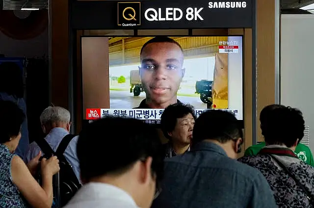 A TV screen shows a file image of American soldier Travis King during a news programme at Seoul railway station in South Korea