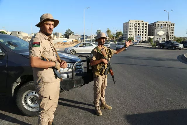 Libyan security forces stand guard in Tripoli, Libya