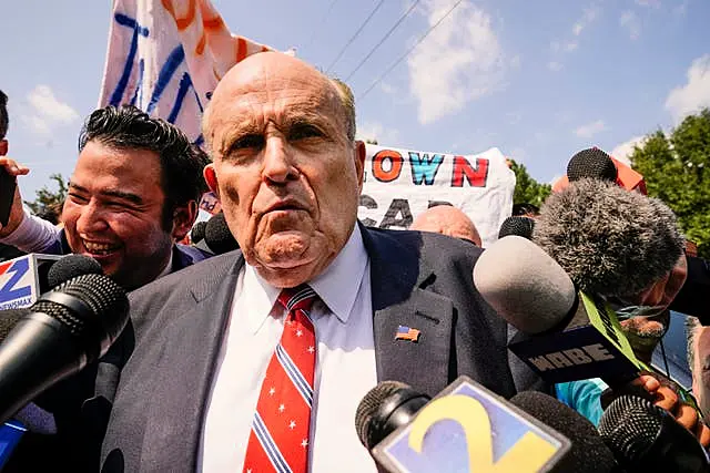 Rudy Giuliani speaks outside the Fulton County jail in Atlanta