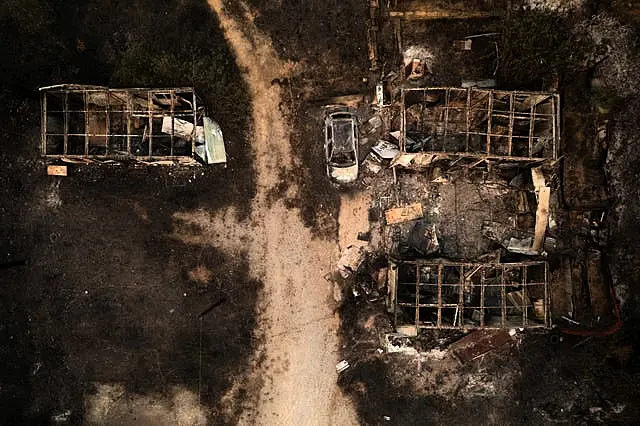 A burnt car and warehouses are seen from above in the village of Palagia, near Alexandroupolis