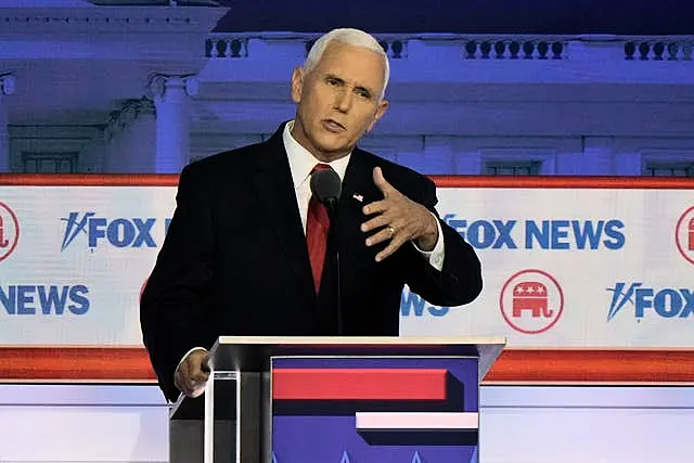 Republican presidential candidate and former vice president Mike Pence speaks during a Republican presidential primary debate in Milwaukee 