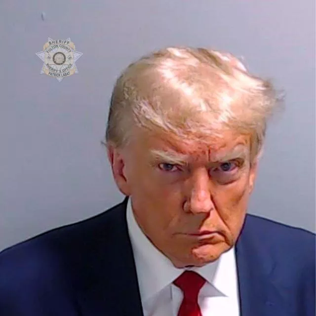 This booking photo provided by the Fulton County Sheriff’s Office shows former president Donald Trump on August 24 after he surrendered and was booked at the Fulton County Jail in Atlanta
