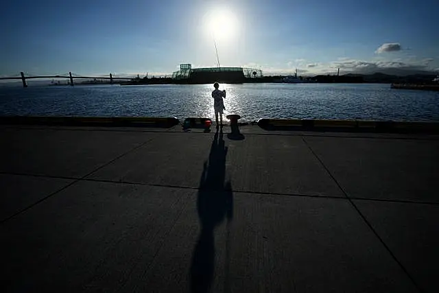 An angler fishes at Onahama Port in Iwaki, northeastern Japan, 42 miles)from the Fukushima Daiichi nuclear power plant, (Eugene Hoshiko/AP)