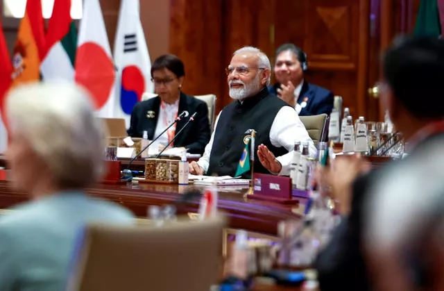 Indian Prime Minister Narendra Modi gestures as he attends “Session II: One Family” at the G20 summit in New Delhi, India 