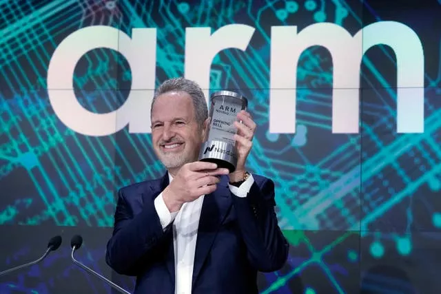 Arm Holdings chief executive Rene Haas holds the Nasdaq Opening Bell Crystal at the Nasdaq MarketSite during his company’s IPO in New York’s Times Square