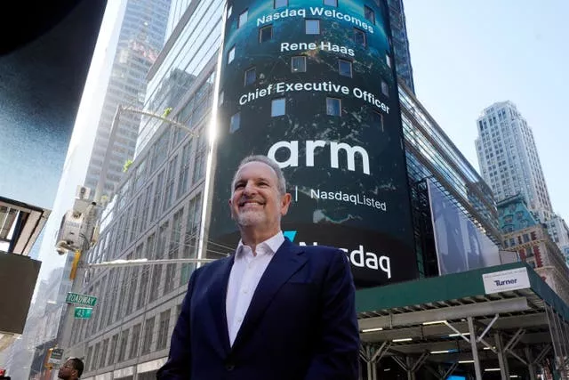Arm Holdings chief executive Rene Haas poses for photos outside the Nasdaq MarketSite, during his company’s IPO, in New York’s Times Square