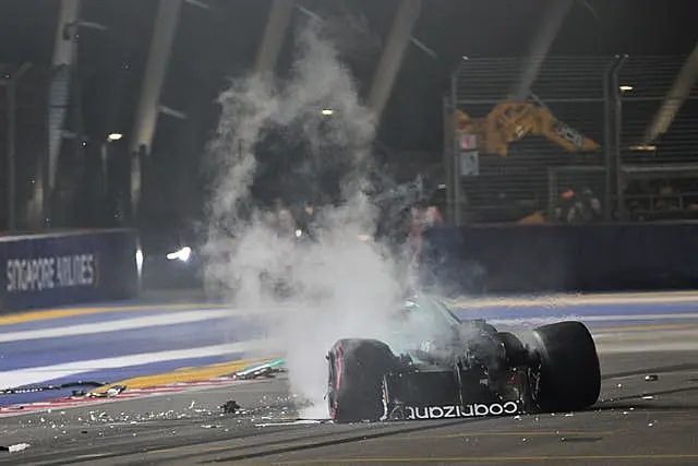 Smoke billows from Lance Stroll's Aston Martin