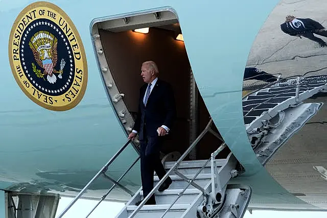 US President Joe Biden walks down the steps of Air Force One at John F. Kennedy International Airport in New York