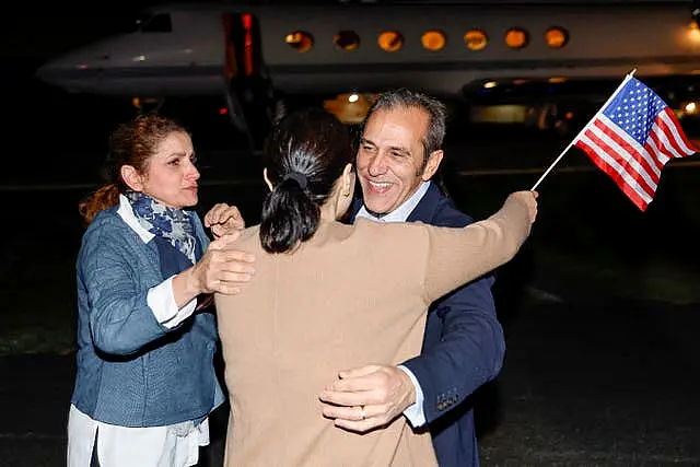 Family members embrace freed American Emad Shargi