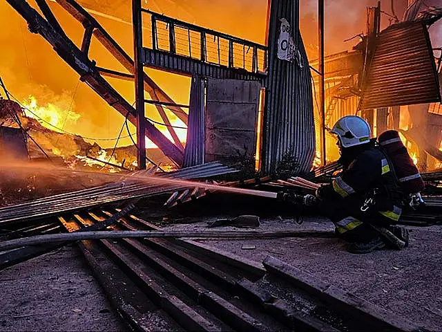 Firefighters working after a Russian attack in Lviv on Tuesday