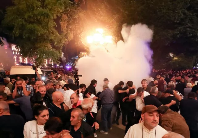 Demonstrators clash with police at Armenia's government building in Yerevan