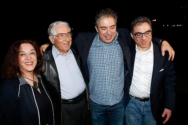 Family members greet Siamak Namazi, Morad Tahbaz and Emad Shargi