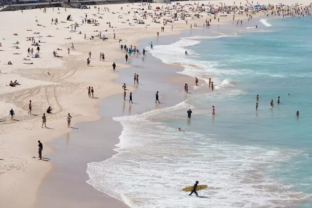 People gather on Bondi Beach in Sydney on Tuesday