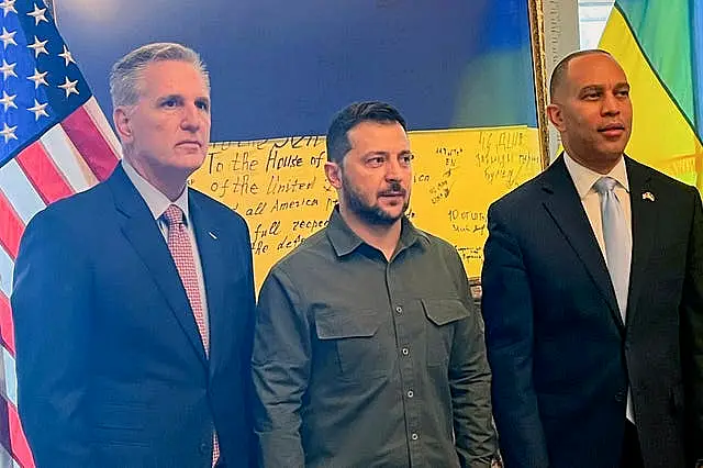 Ukrainian president Volodymyr Zelensky, centre, with House Speaker Kevin McCarthy, left