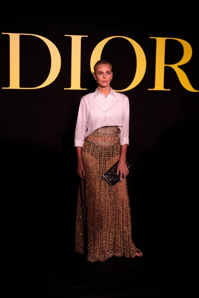 Charlize Theron poses before Christian Dior Spring/Summer 2024 womenswear collection presented Tuesday, Sept.26, 2023 in Paris