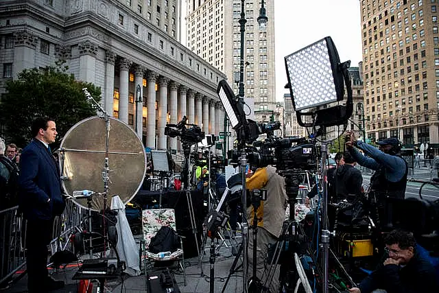 Members of the press  outside the court building