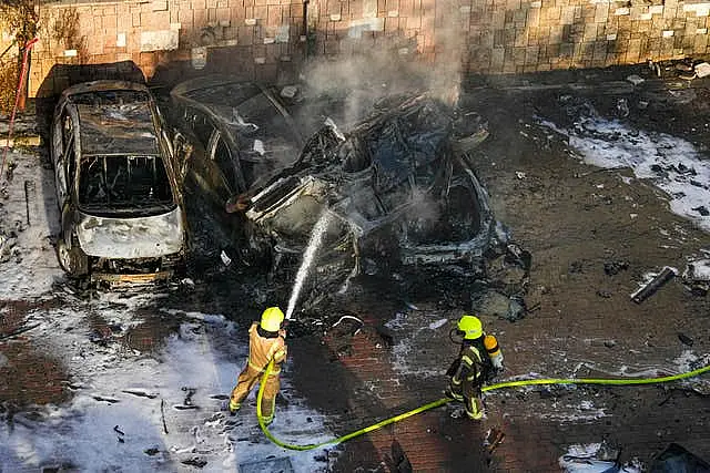 Israeli firefighters extinguish a blaze 