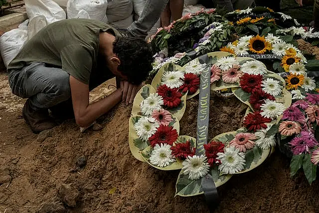 A man mourns during the funeral of Israeli Colonel Roi Levy at the Mount Herzl cemetery in Jerusalem on Monday