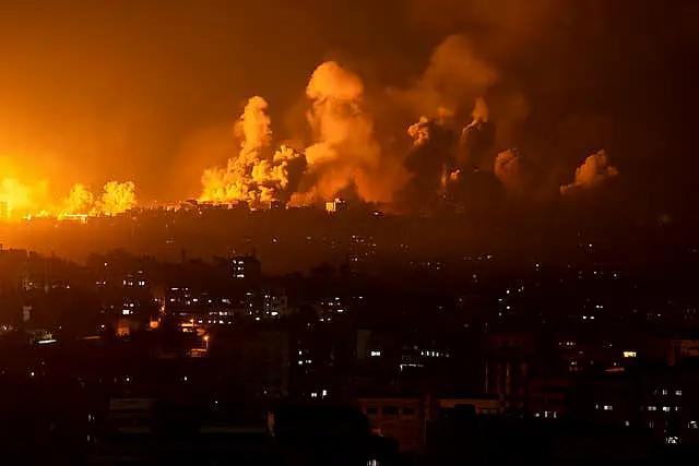 Fire and smoke rise following an Israeli airstrike in Gaza City 