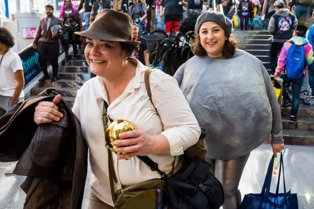 People dressed as Indiana Jones and the boulder from Raiders Of The Lost Ark
