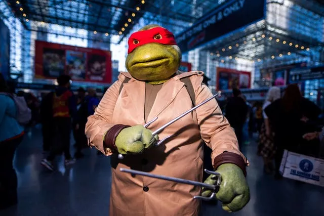 A Teenage Mutant Ninja Turtle poses during New York Comic Con