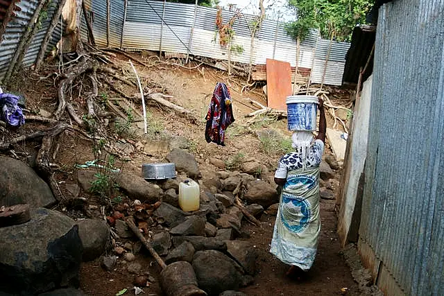 Woman carries water