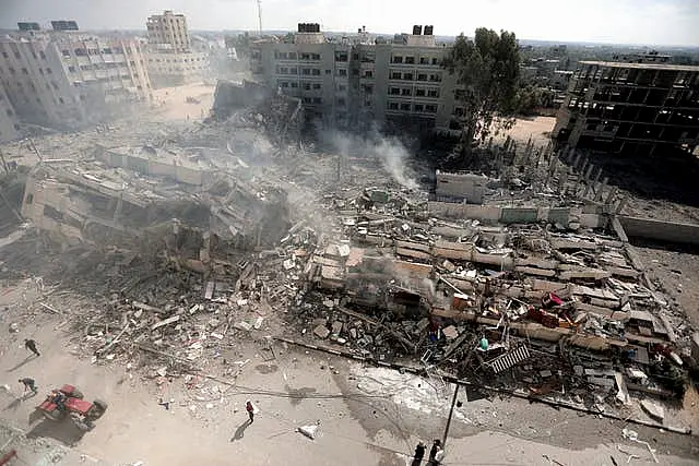 Smoke rises from destroyed buildings, following Israeli air strikes on Gaza City, central Gaza Strip