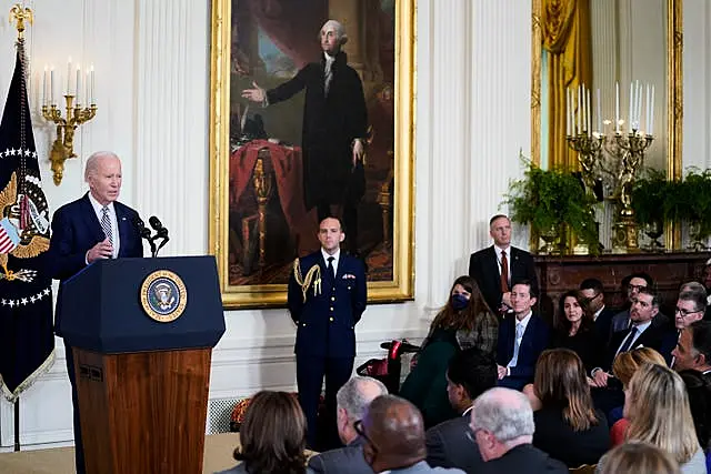 President Joe Biden delivers remarks about government regulations on artificial intelligence systems during an event in the East Room of the White House