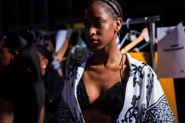A model dresses up backstage for Bare’s show