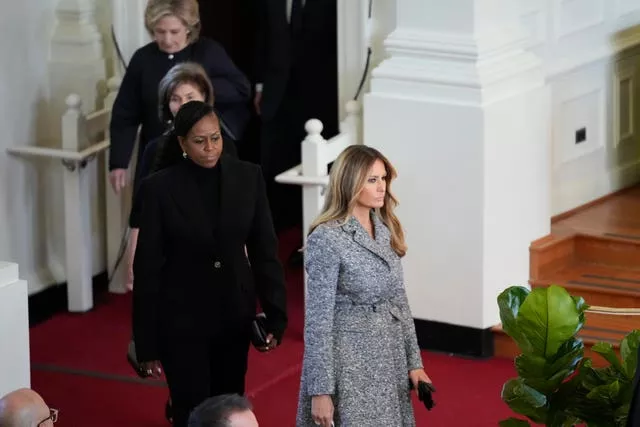 Former first ladies Melania Trump, Michelle Obama, Laura Bush and Hillary Clinton arrive to attend a tribute service for former first lady Rosalynn Carter at Glenn Memorial Church in Atlanta