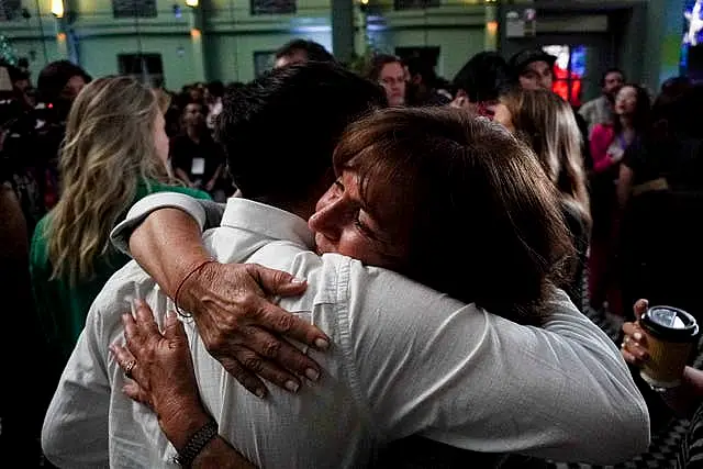 People against the draft of a new constitution celebrate after the polls close