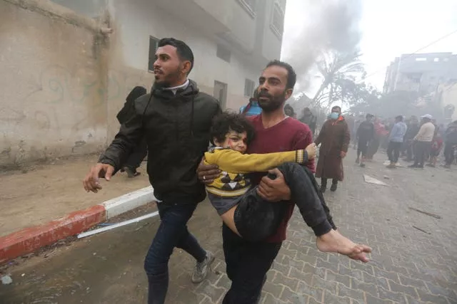 Palestinians evacuate survivors of an Israeli strike in Rafah, Gaza Strip 