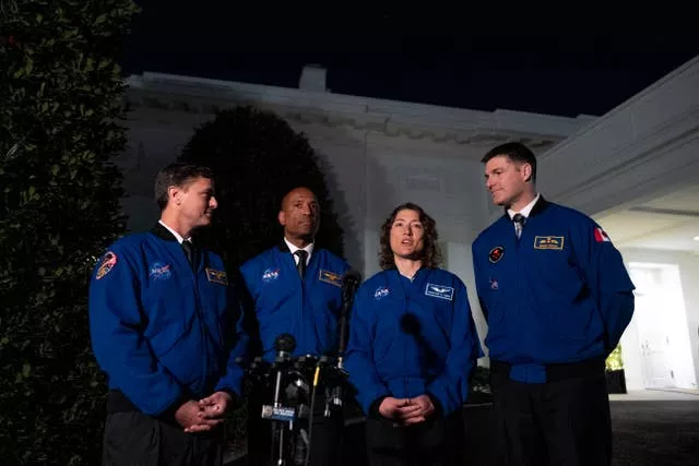 Artemis II crew members, from left, Reid Wiseman, Victor Glover, Christina Hammock Koch, and Jeremy Hansen speak to members of the media outside the West Wing of the White House in Washington on Thursday