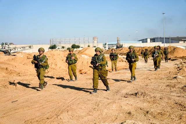 Israeli soldiers are seen during a ground operation in the northern Gaza Strip on Friday