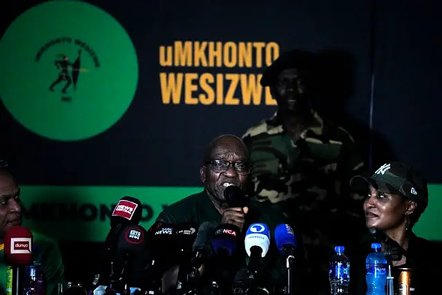 Mr Zuma, centre, speaks as his daughter Duduzile Zuma-Sambudla listens during a press conference where he denounced his former party the ANC