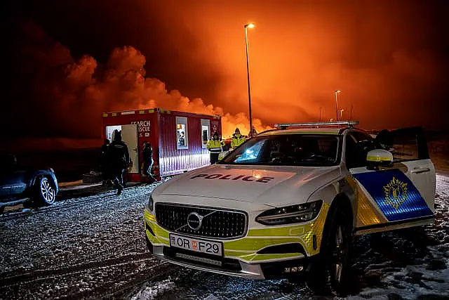 A police car at the entrance of the road to Grindavík