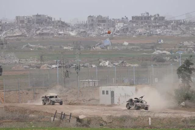 Israeli army vehicles near the Gaza Strip border, in southern Israel